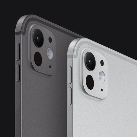 Two iPad Pro devices, back and side exterior, portrait orientation, space black colour and silver colour, volume-up button, volume-down button, pro camera system